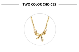 Detail of 18K gold plated bow necklace showing delicate chain and two color options