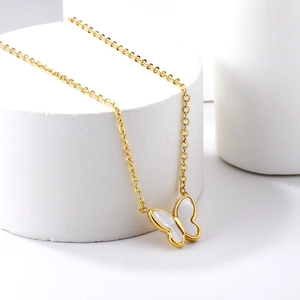 Elegant 18K gold plated bow necklace with iridescent white mother of pearl inlay