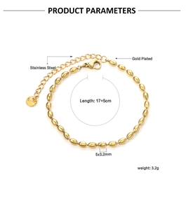 Detail of gold-plated stainless steel wheat bead bracelet with lobster clasp and tag