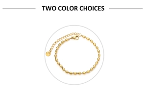 Detail of golden stainless steel wheat bead bracelet showing lobster clasp and two colors