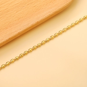 Classic gold stainless steel wheat bead bracelet with polished oval metallic beads