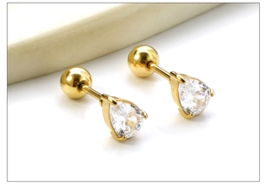 Macro shot of gold stainless steel stud earrings with pear-cut zirconia and ball backs