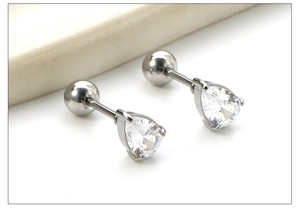 Macro view of teardrop zircon earrings with stainless steel screw backs for cartilage