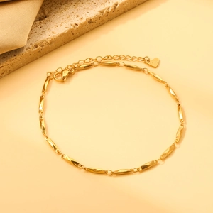 Golden stainless steel anklet with twisted rectangular links and heart charm pendant
