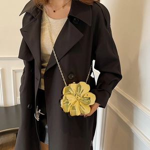 Chic gold flower-shaped crossbody bag with metallic finish and thin chain strap