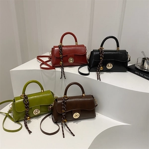 Minimalist square tote bags in red, black, green, and brown with gold twist locks