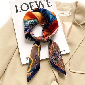 Elegant mulberry silk square scarf with vintage leaf print on a fashion magazine
