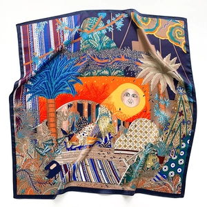 Detailed view of the vibrant silk scarf featuring surreal jungle motifs and tigers