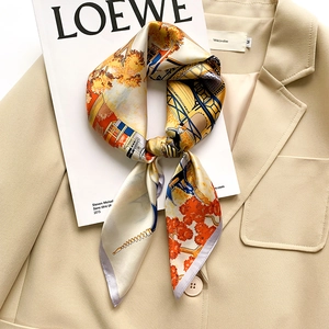 Elegant 65x65cm silk square scarf with vibrant illustrative print on a beige blazer
