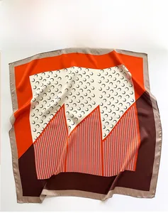 Detail of silk square scarf featuring geometric moon patterns and plant-based dyeing