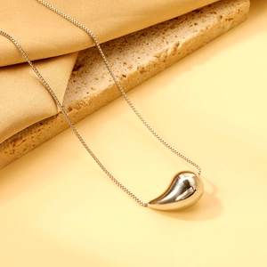 Elegant gold teardrop pendant necklace on a minimalist box chain for women