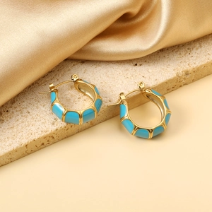 Minimalist C-shaped bamboo-style gold earrings with light blue enamel finish