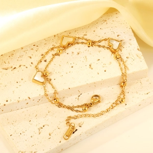 Bracelet double couche doré en acier inoxydable avec cœurs en nacre blanche sur pierre