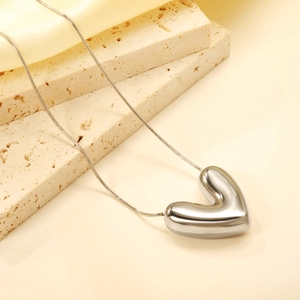 Minimalist silver heart pendant necklace in polished 18K gold plated stainless steel