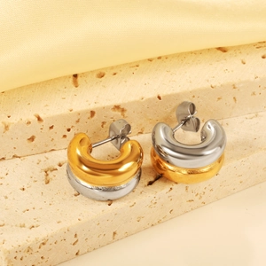 Two-tone gold and silver C-shaped chunky hoop earrings with a polished mirror finish