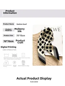Detail of silk square scarf with black polka dots draped on a beige knit sweater