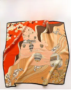Detail of square silk scarf showing botanical dyeing and oriental floral pattern