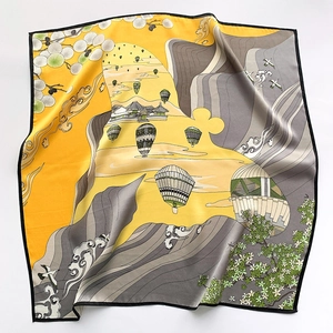 Silk square scarf with yellow and grey mountain landscape prints and hot air balloons