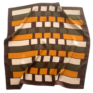 Modern geometric silk square scarf with brown, green and orange patterns on silk fabric