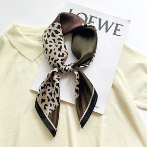 Silk leopard print square scarf with green color-blocking on yellow cardigan