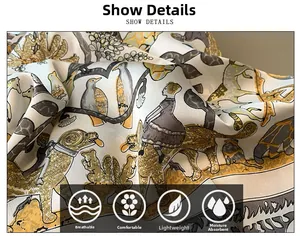 Détail d'un foulard en soie respirant aux motifs vintage d'oiseaux et texture douce