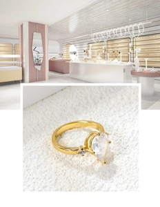 Detailed macro view of an 18k gold-plated ring with a pear-cut diamond-like center stone
