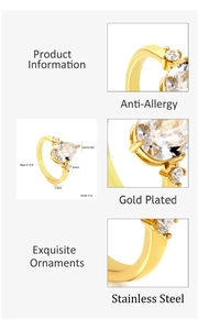 Detailed view of gold plated stainless steel ring featuring a large pear cut cubic zirconia