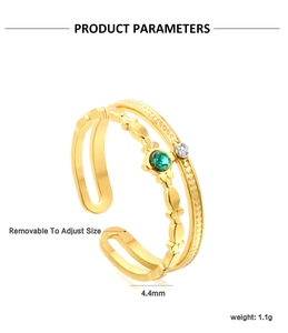 Detail of gold double-layer open ring featuring a green gemstone and wavy metal edge