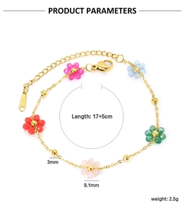 Detailed view of colorful pearl flower charms on a golden stainless steel chain link