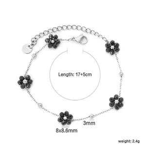 Détail du bracelet en acier inoxydable à fleurs noires avec dimensions 17+5cm et 8x8,6mm