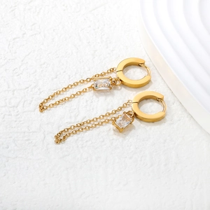 Detail of 18K gold stainless steel earrings with zircon tassels and chain drops