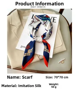 Detail of silk-like satin square scarf with retro chain print on fashion magazine