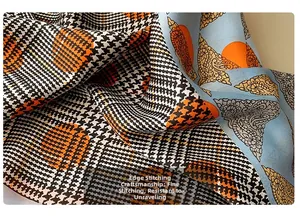 Close-up of fine overlock stitching and silk texture on printed square neck scarf
