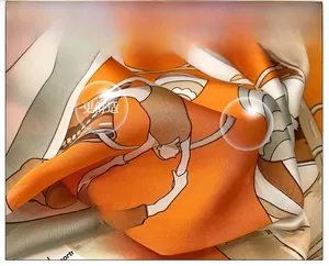 Close-up of printed silk scarf featuring artistic illustration and twill texture