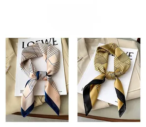 Detail of silk-like neckerchief with geometric patterns tied in a stylish knot