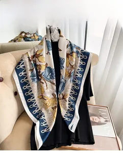 Detailed texture of autumn twill square scarf with yellow floral and navy rope patterns