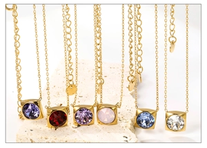 Detailed view of square zircon pendant necklaces in multiple colors with gold chains