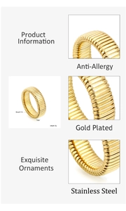 Detail view of gold-plated stainless steel ring with a 7mm width and wavy texture