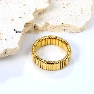 Modern gold-plated elastic stainless steel ring with segmented design on stone base