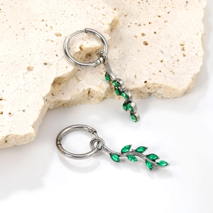 Silver leaf hoop earrings with green zircon olive branch charm on light stone base