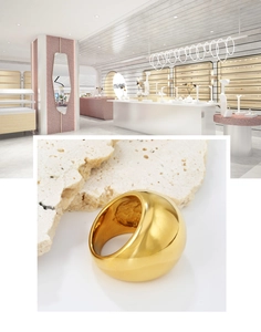 Gros plan d'une bague bombée en acier inoxydable plaqué or 18 carats sur pierre