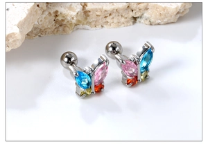 Macro shot of silver butterfly studs with colorful rhinestones and ball screw back