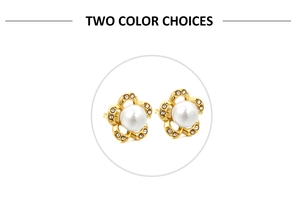 Close-up of golden five-petal flower earrings with white pearl center and rhinestones