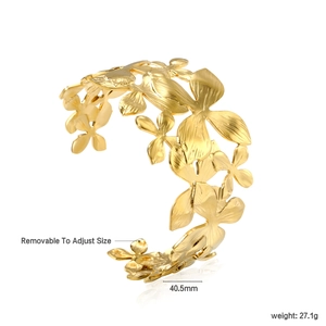 Bracelet manchette ajustable en acier inoxydable doré avec motif floral superposé