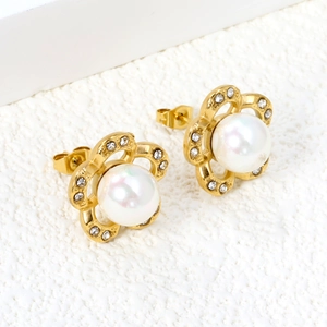 Elegant gold flower earrings with white pearl center and sparkling zircon accents
