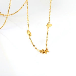 Collana natalizia dorata con ciondoli a forma di fiocco di neve, albero e renna