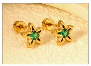 Close-up of gold star earrings with green gemstones and secure flat back screw-ins