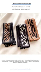 Detail of 5.5x118cm leopard and zebra print silk scarf tied as a luxury bag accessory