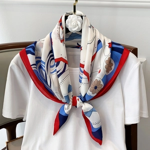 Navy blue and red printed silk scarf for women styled as an elegant neck tie over a white tee