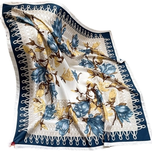 Elegant floral silk square scarf with blue and yellow flower prints on a white background